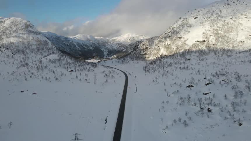 A road runs through the mountain range