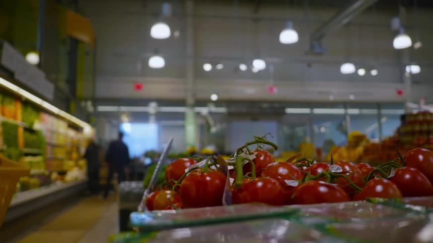 A woman browses a grocery store
