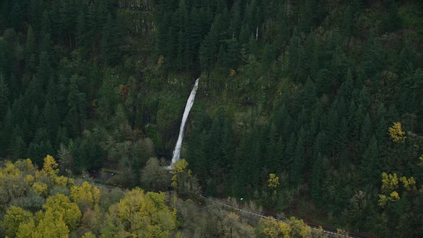 Horsetail falls plunges over a cliff in the columbia river gorge during autumn