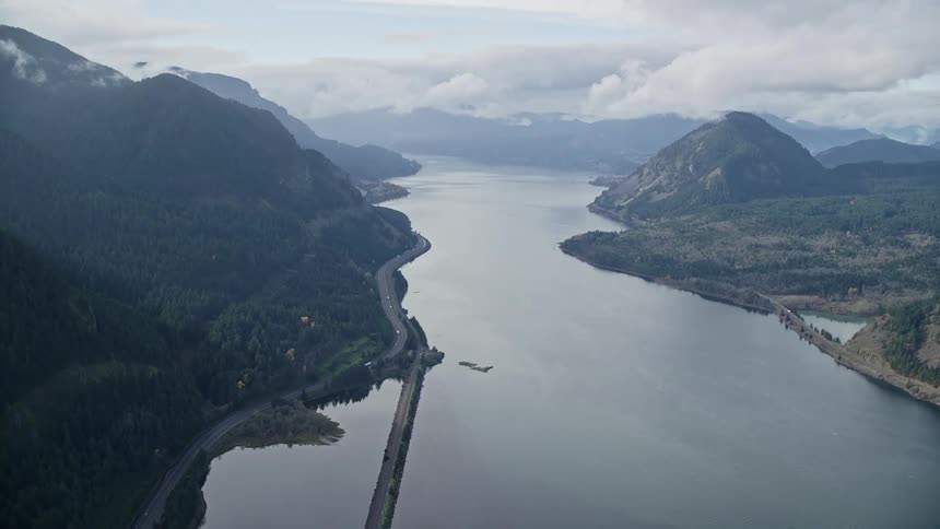 Aerial panorama of a central river amidst a mountain range