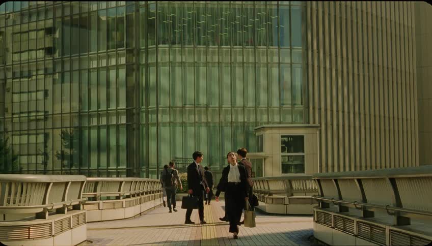 A woman walks away from the building