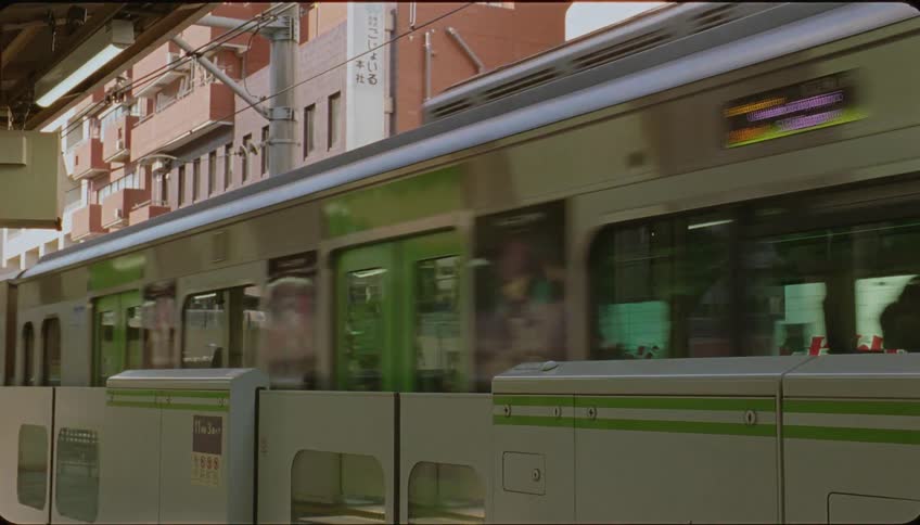 A subway train pulling into a train station
