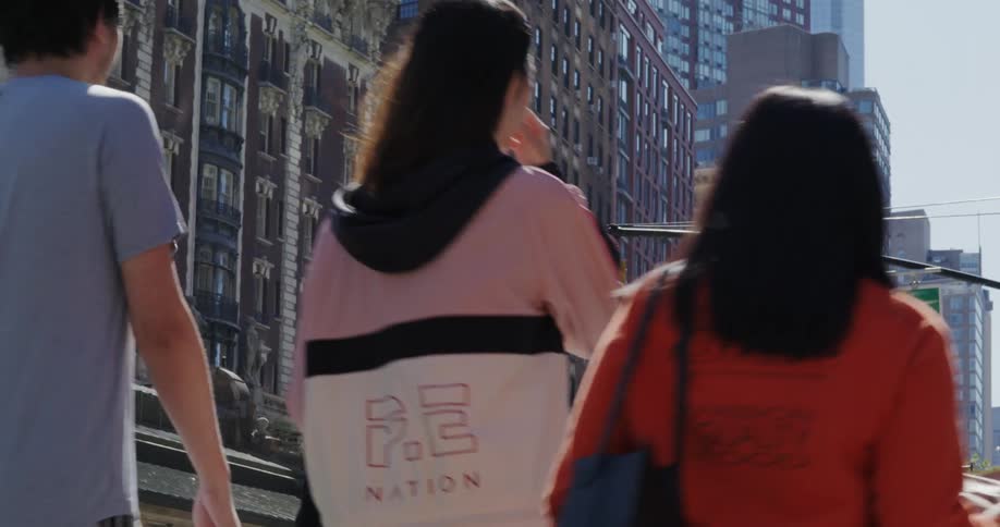 Pedestrians crossing the street in a downtown area of a city