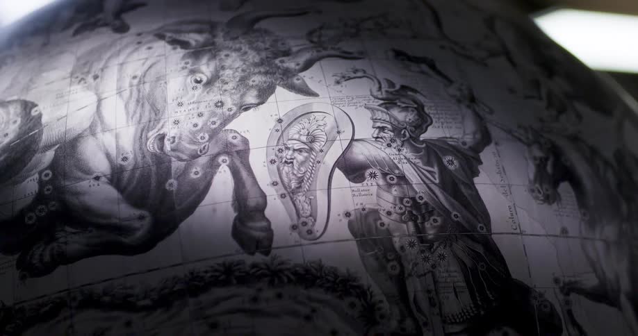 Close up of the mythological art on the surface of a globe