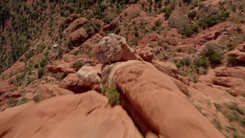 Flying close to the surface of a rocky canyon
