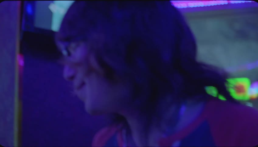 Friends have fun singing karaoke at a party