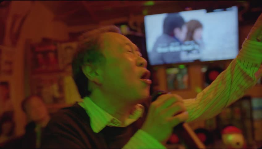 People having fun at a karaoke party