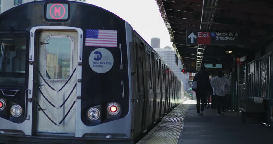 Metro train departs a station in the city