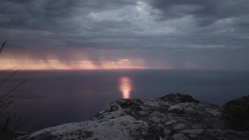 The sun sets over the ocean