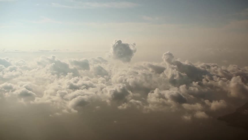 There are many clouds below floating