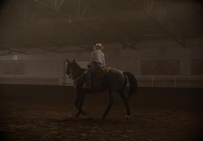 Person riding a horse inside a circle