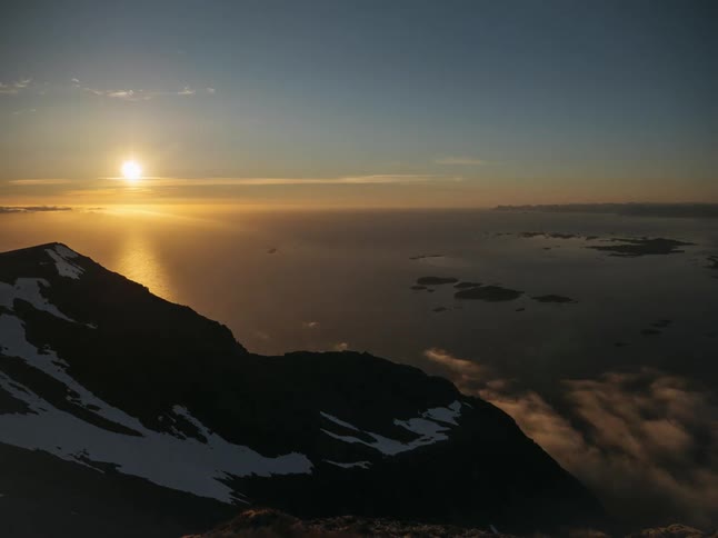 A mountain with snow from sunst to sun rise