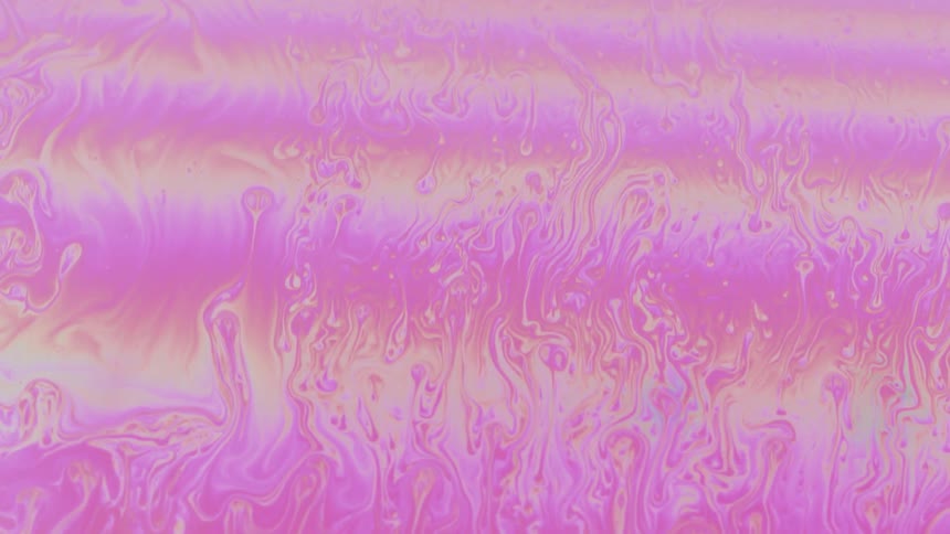 Pink psychedelic abstract fluid in slow motion