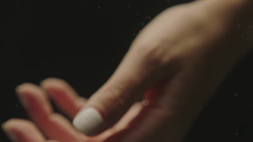 A female hand not moving