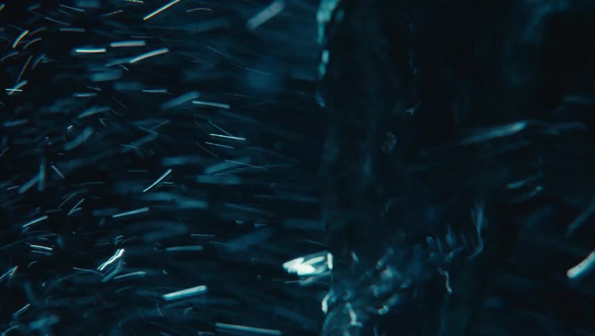 A blue liquid is spinning quickly