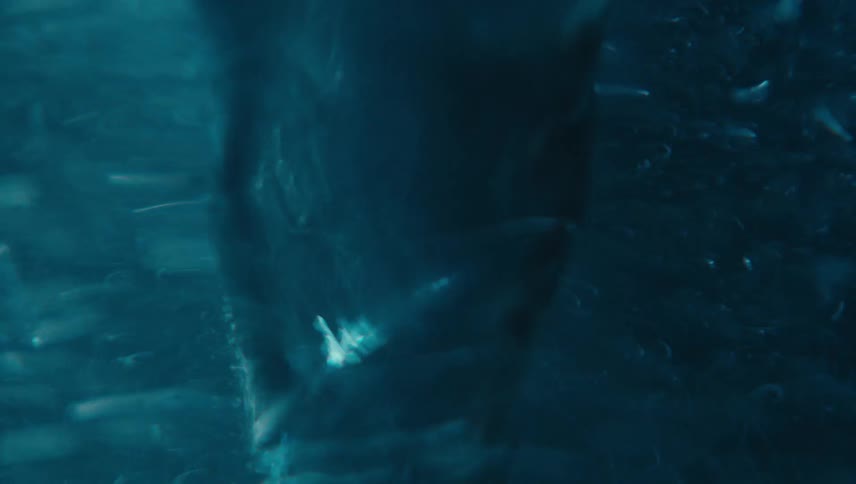 A liquid is spinning and making a lot of movement underwater