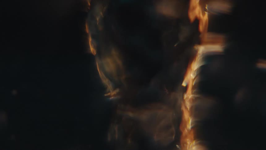The object is spinning fast with bubbles all around