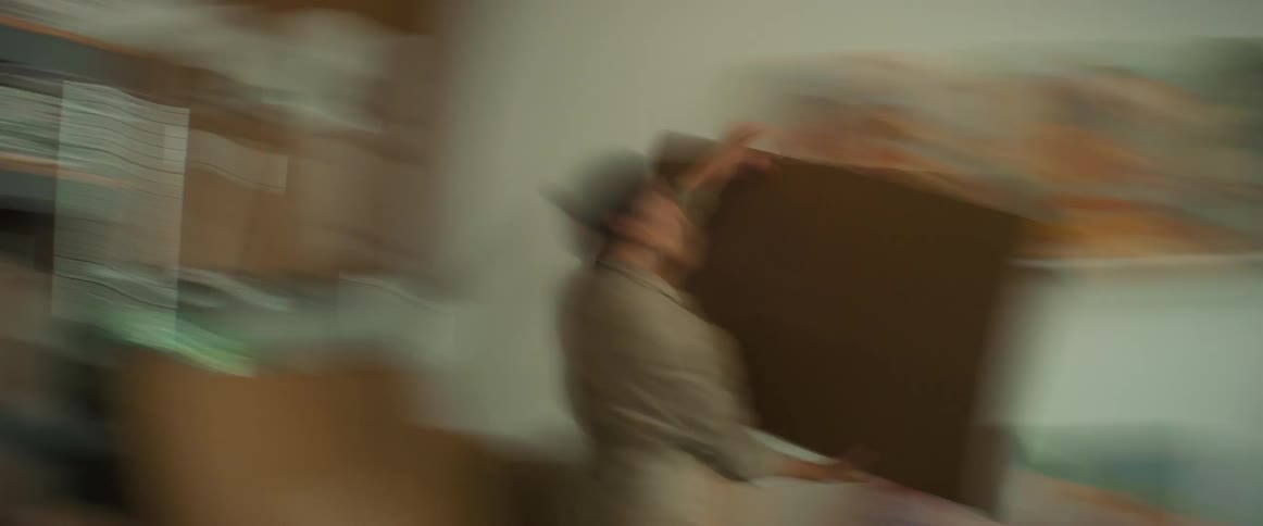 Time lapse of an artist boxing a painting for shipping
