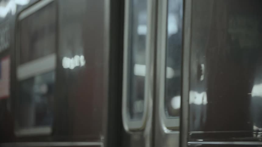 Closeup of a subway train coming to a stop