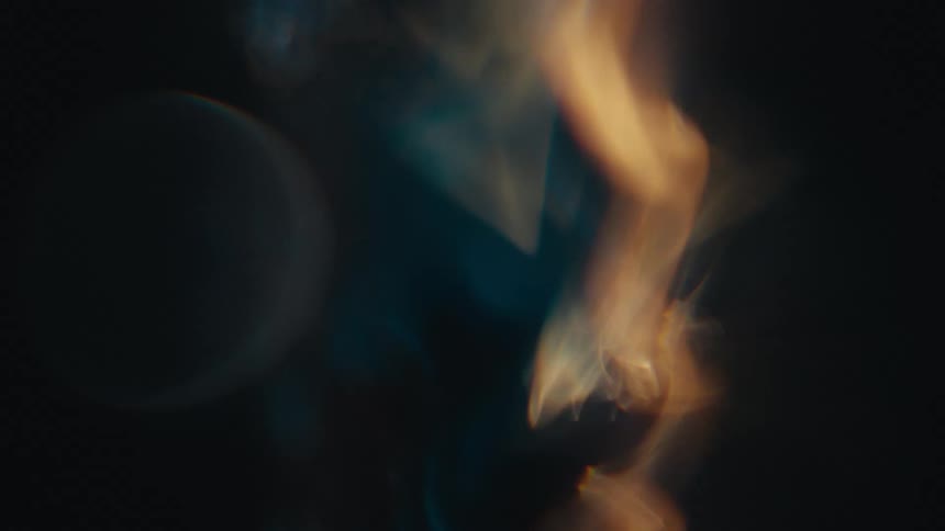 Flames flicker against black background