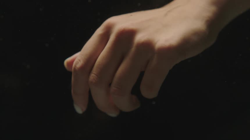 Extreme closeup of a womans hand in motion