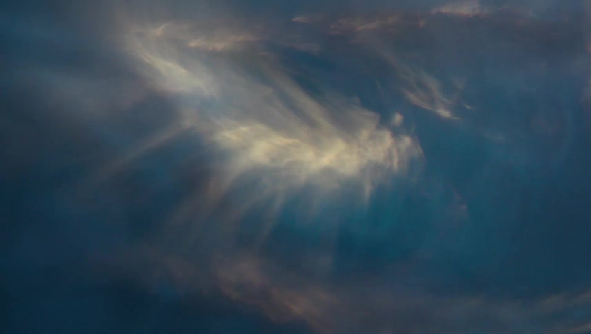 Extreme closeup of a spiral underwater with reflections