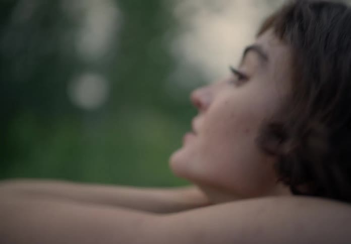 Portrait of a woman in a field