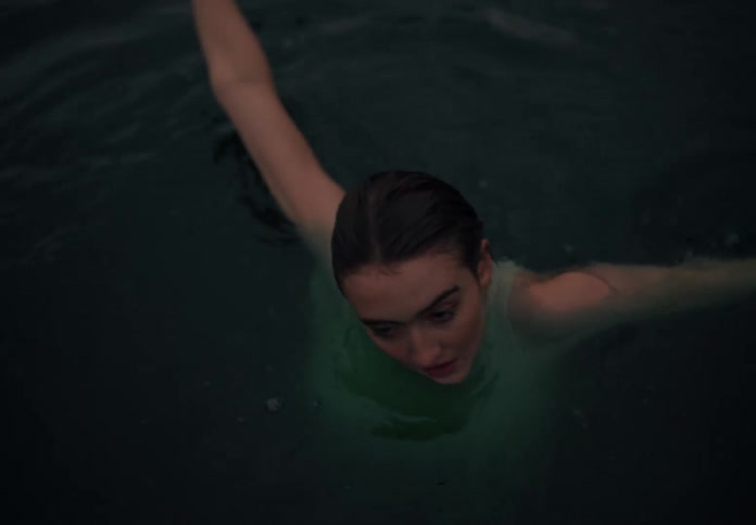 Portrait of a woman dancing in the water