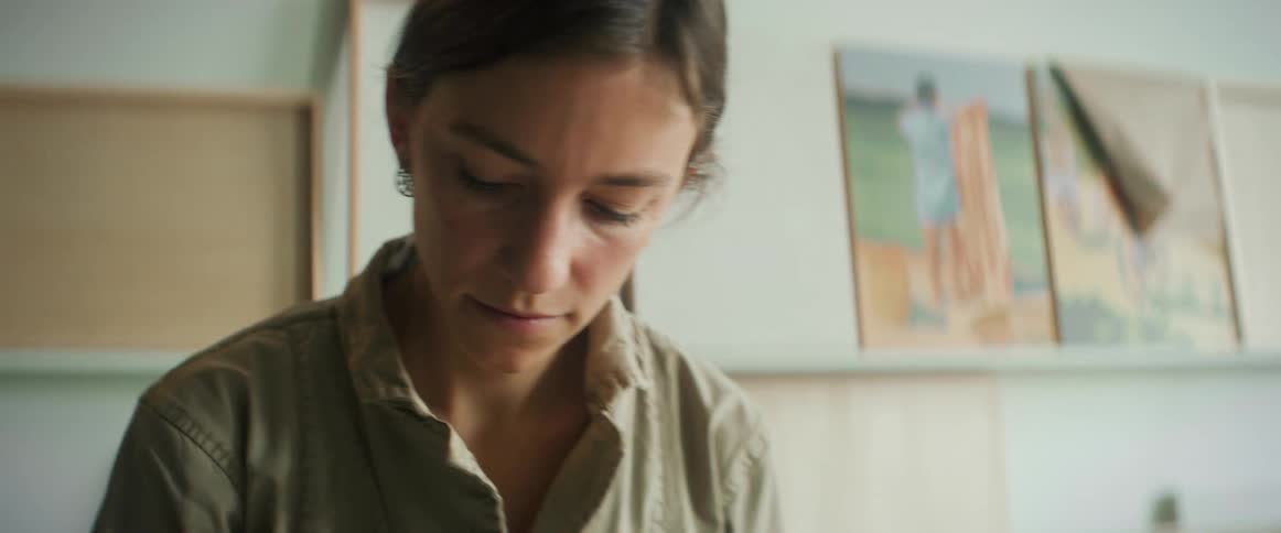 Portrait of a female artist inside a room