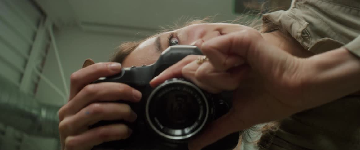 Artist takes pictures in her studio