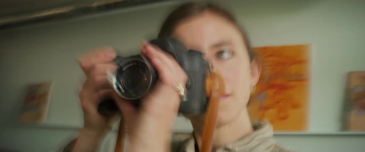 Artist takes pictures with a camera
