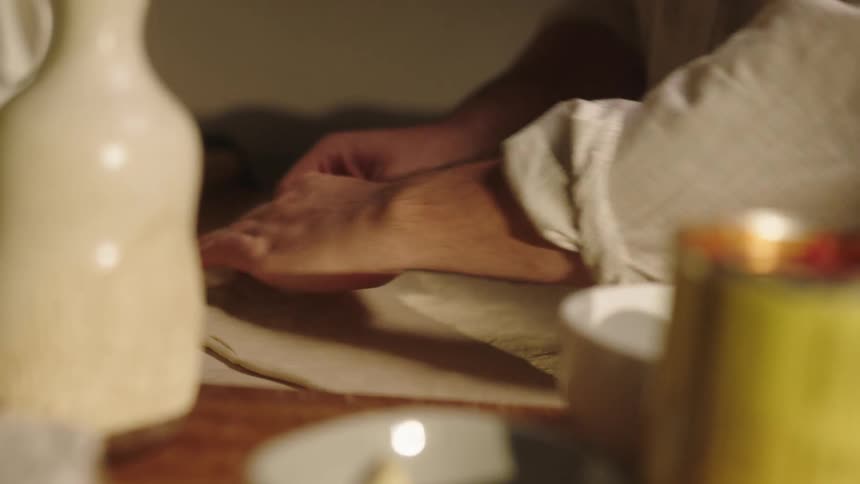 Close up of a man making pizza at home
