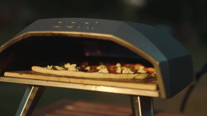 Pizza cooking inside an oven at home
