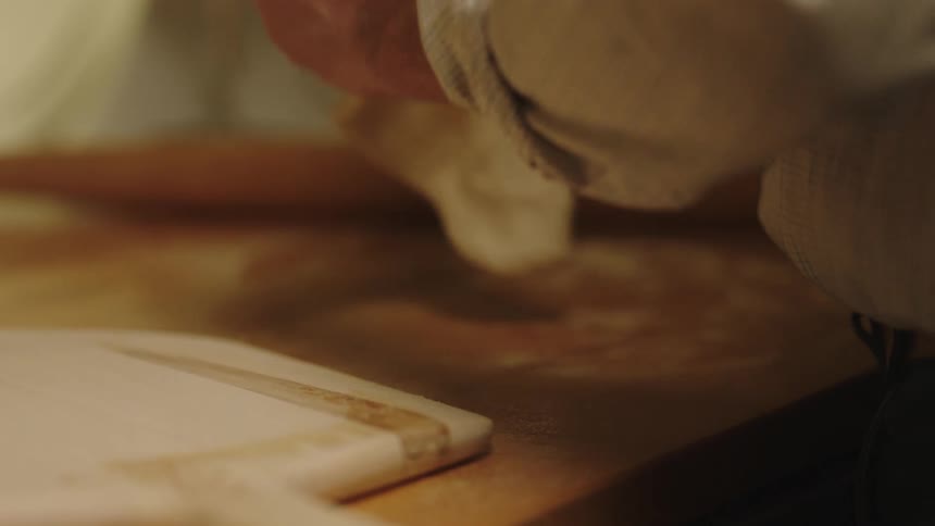 A person making pizza dough for dinner
