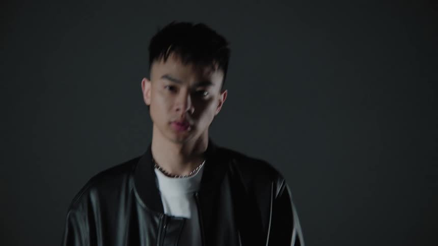 A model is posing in a leather jacket