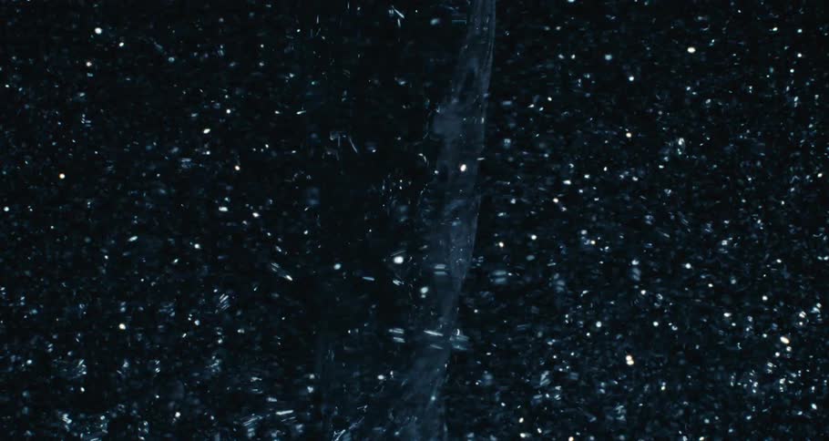 Close up of swirling clear water against a black background