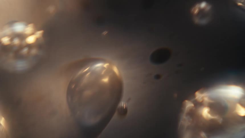 Air bubbles and dirt particles swirling in water