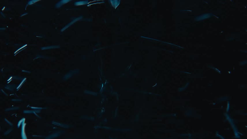 Extreme closeup of water spinning rapidly in an abstract manner