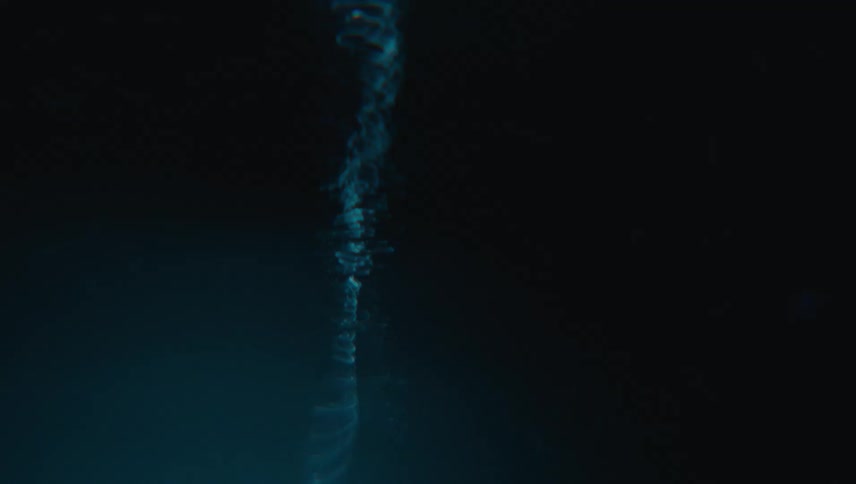 Close up of swirling clear water against a black background