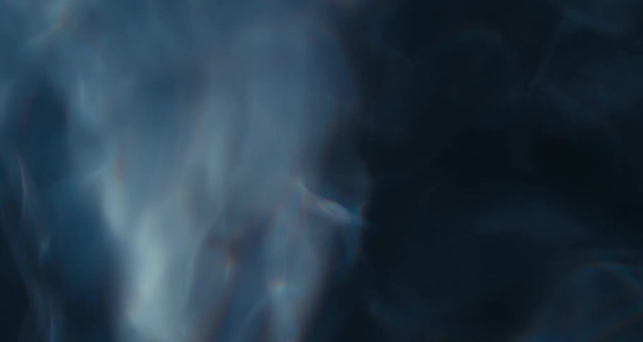 Close up of swirling clear water against a black background