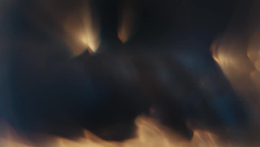 Extreme closeup of a spiral underwater with reflections