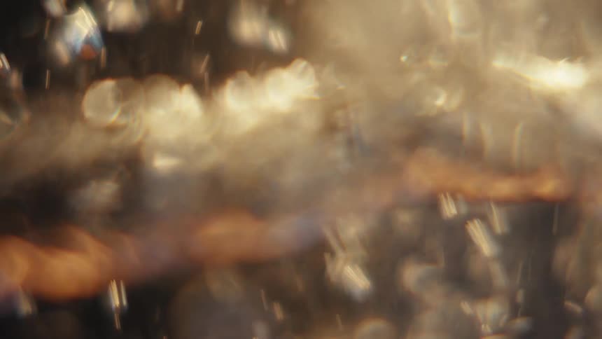 Extreme closeup of a spiral underwater with reflections