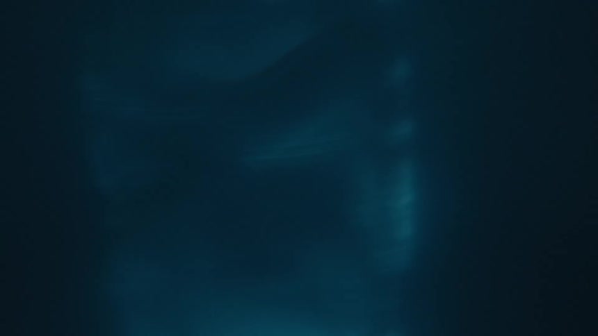 Closeup of a spiral underwater with reflections