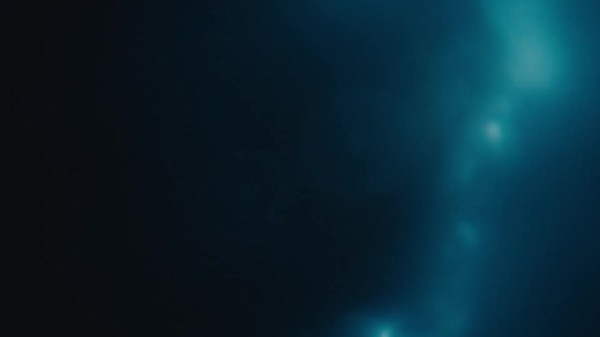 Extreme closeup of water spiraling with bubbles in slow motion