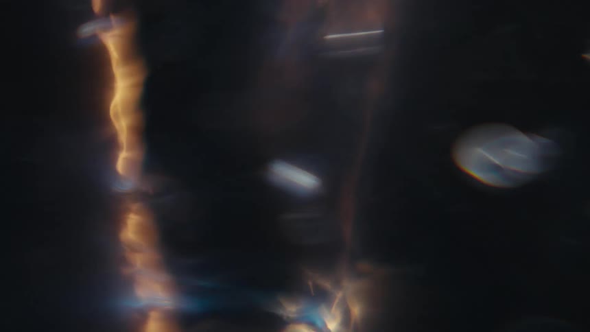 Liquid spinning causing bubbles as light reflect on it