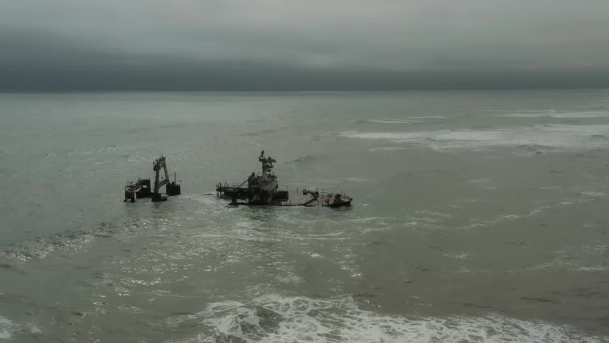 Aerial view of the wreck of a sunken ship near the coast