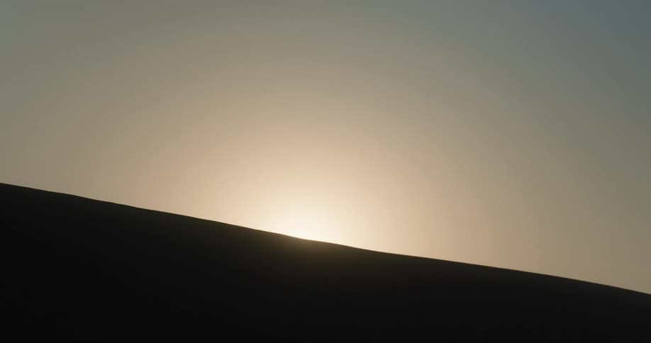 The sunrise on the horizon with the angle turning