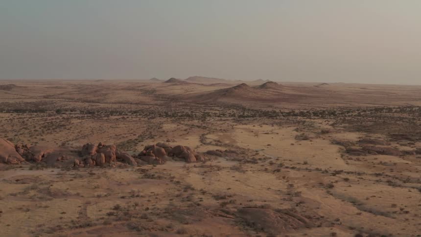 Aerial panorama of mountains and a valley on a day