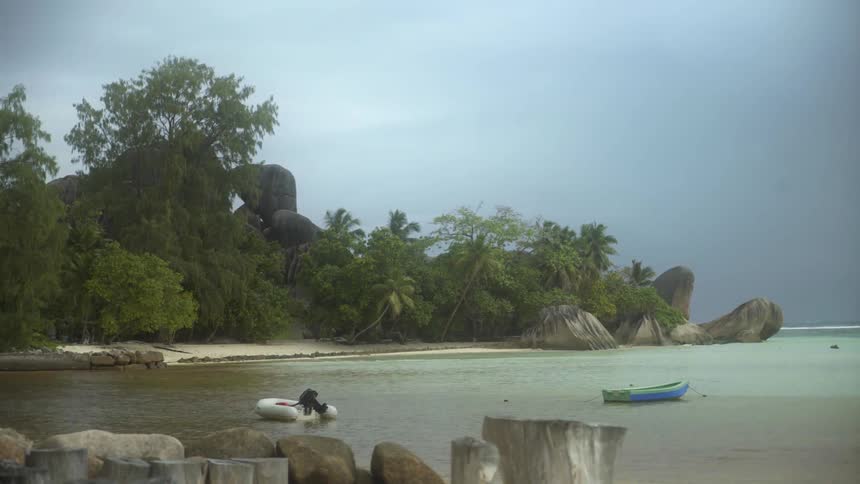 Boats floating on a tropical beach