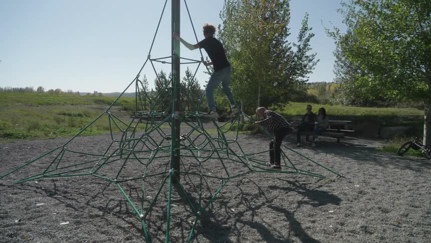 Parents watch their children play